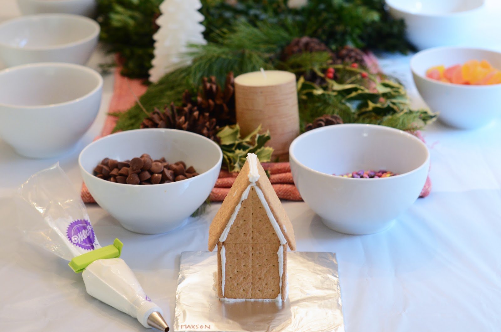graham cracker gingerbread house with frosting