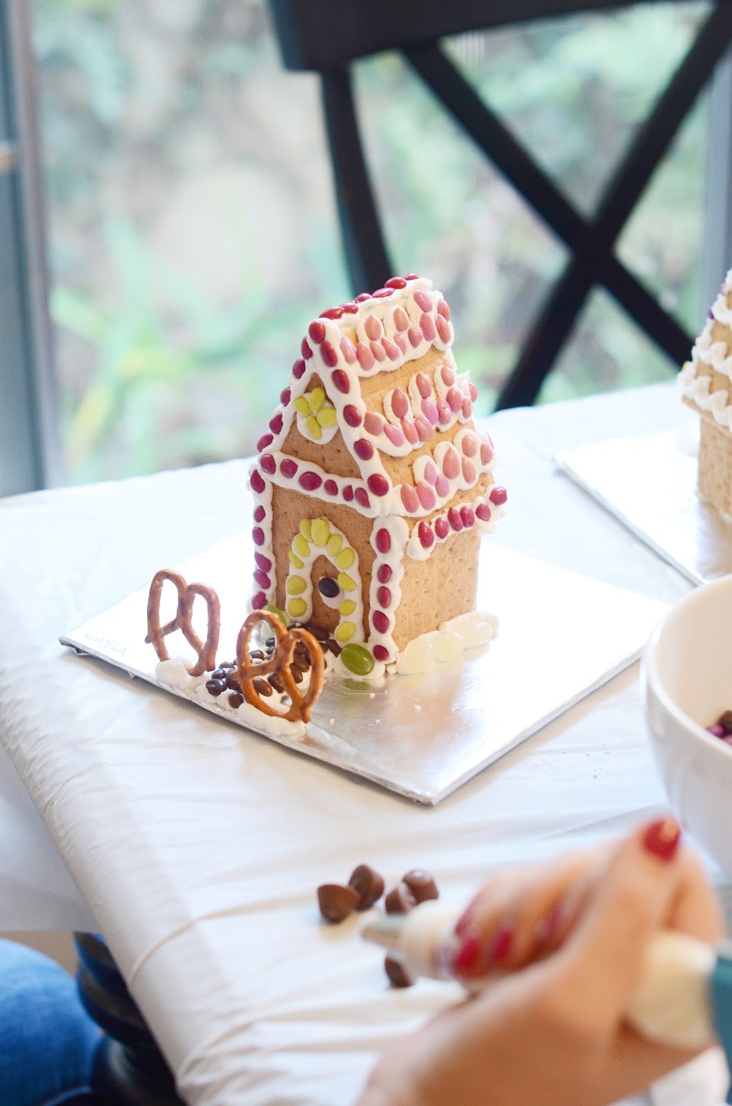 graham cracker gingerbread house on foil tray