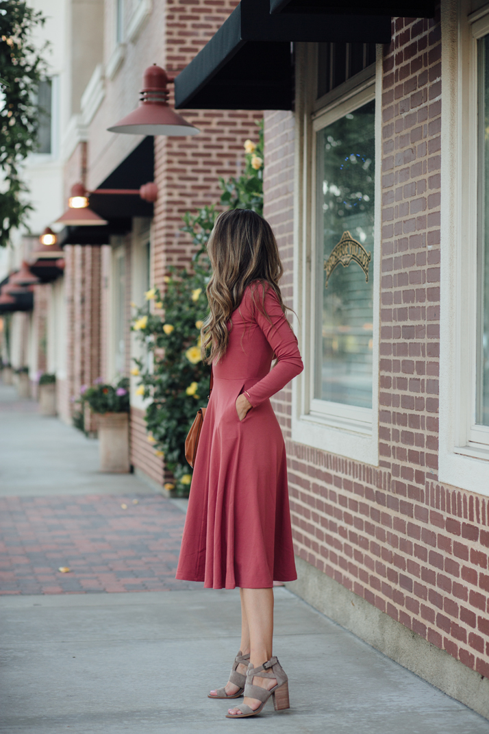 a figure flattering dress and heeled ankle boots make for a perfect date night look