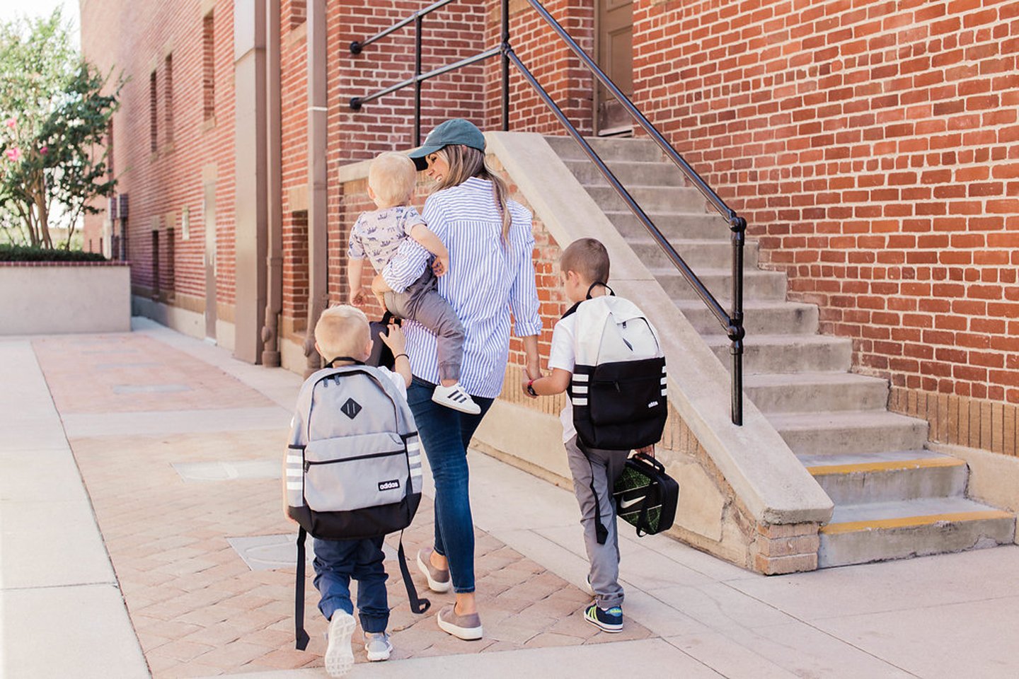 Boy mama with three little boys in Rack Room Shoes Sneakers