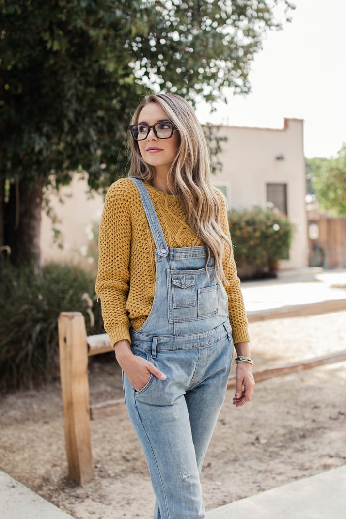 pair your overalls with a thick, cozy sweater for fall