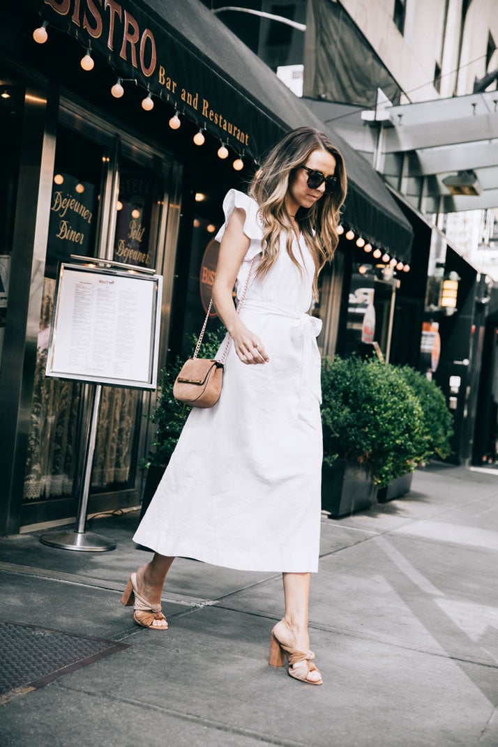 stepping out of the bistro in this crisp white linen dress