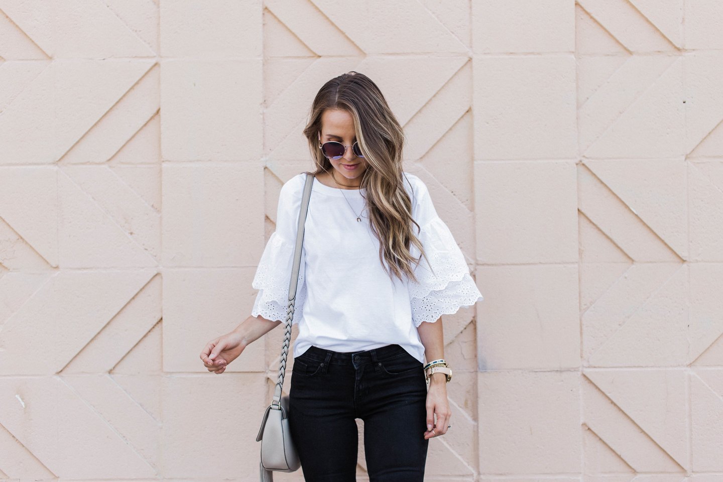 this feminine eyelet sleeve top is great with jeans or a skirt