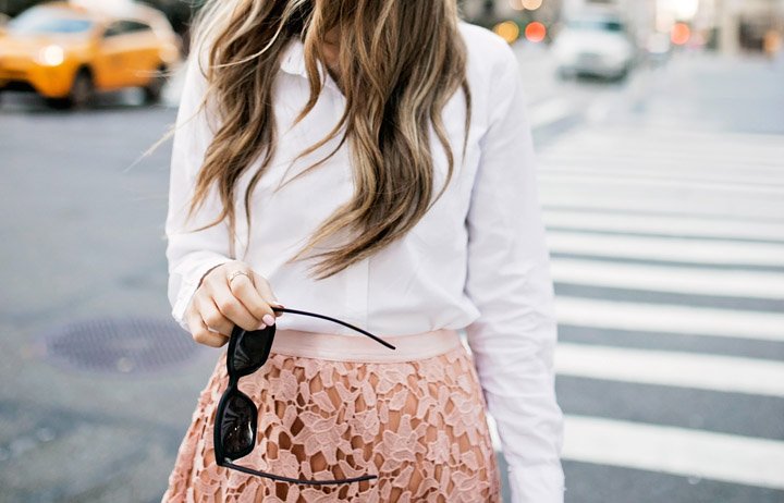 a feminine outfit with edgy sunglasses
