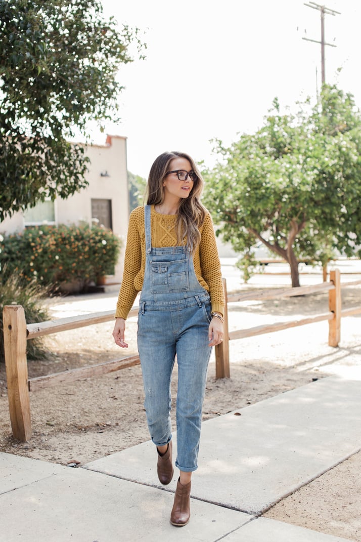 free people overalls with ankle boots and a mustard sweater