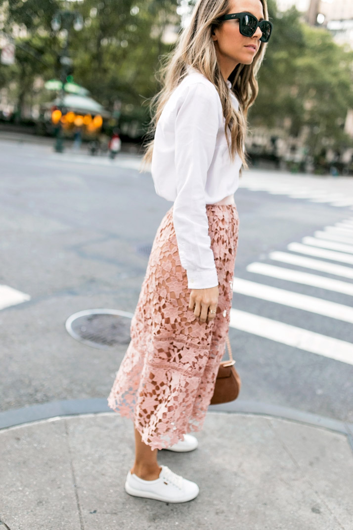 a pink lace skirt and white button down blouse with ecco sneakers