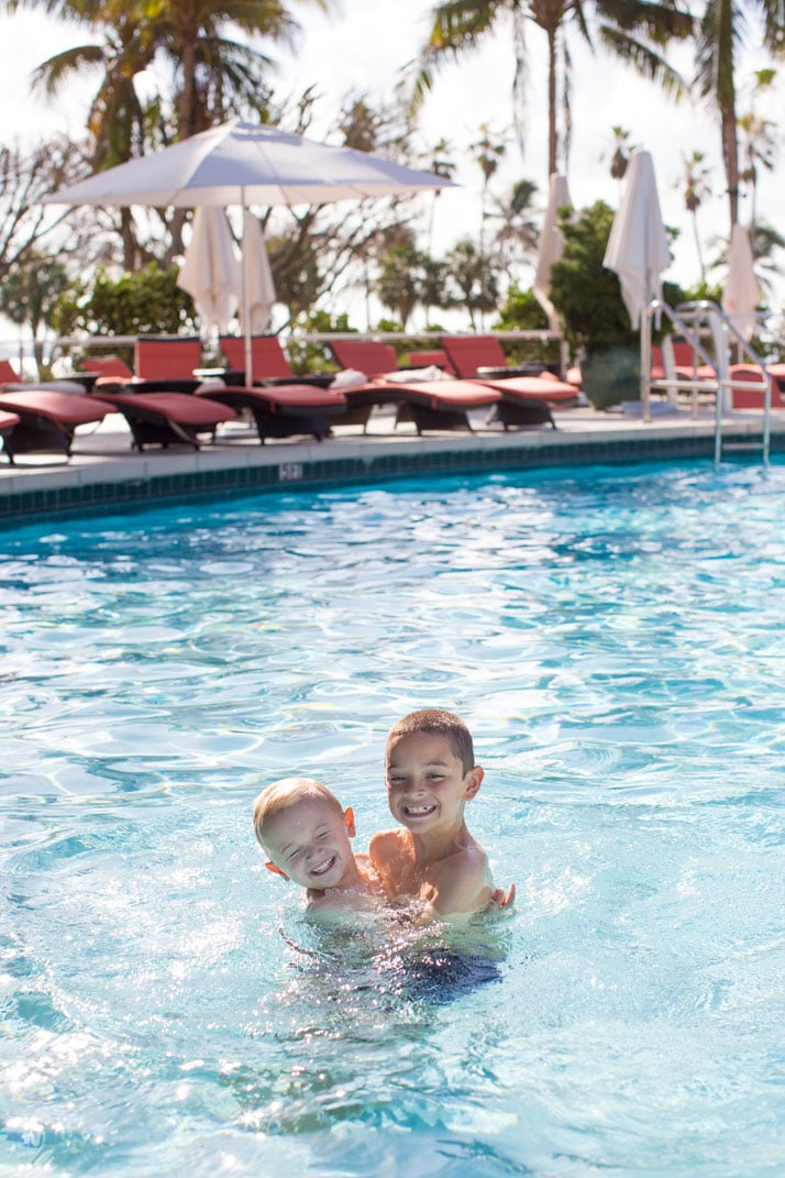 boys in the pool at the mandarin oriental hotel