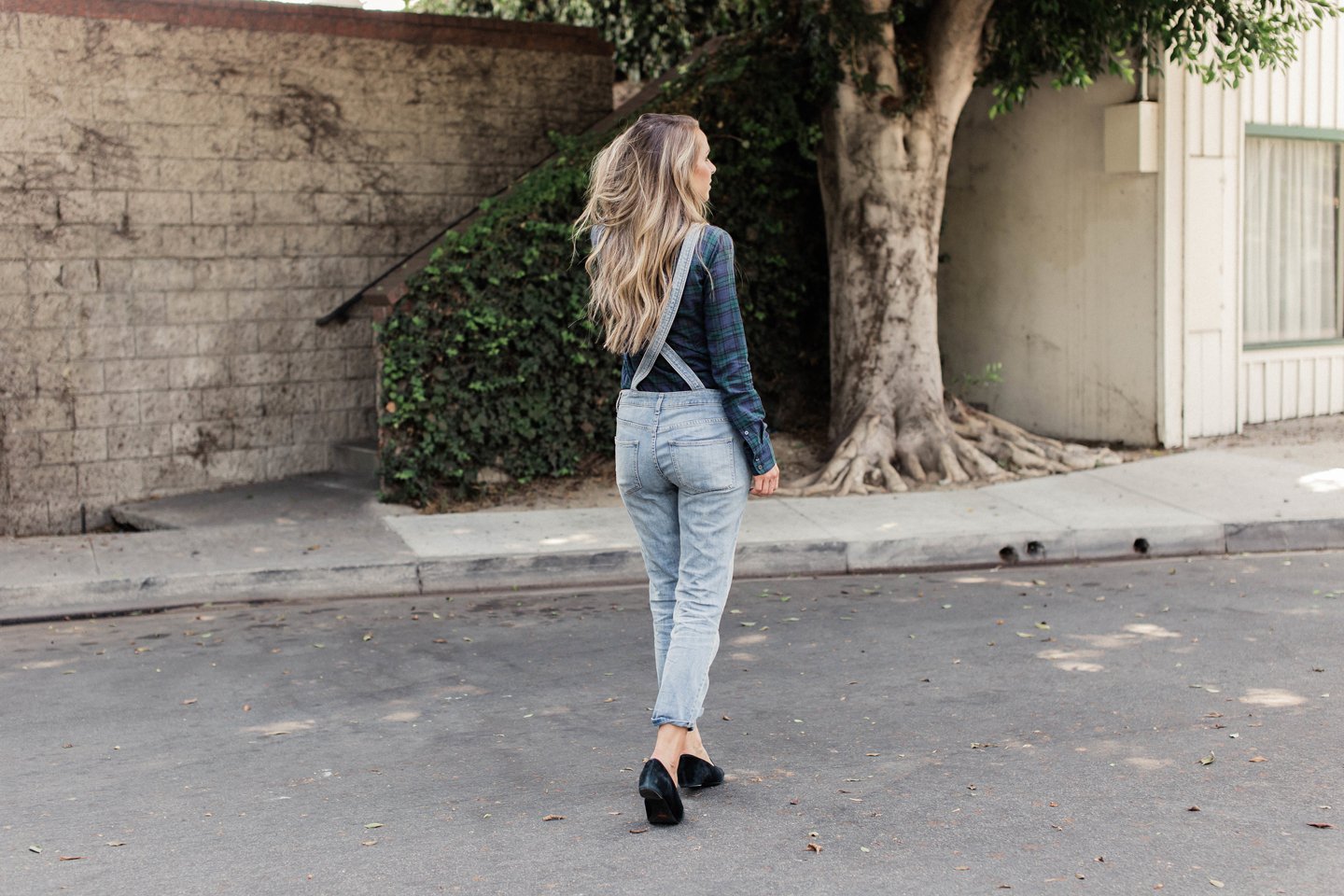Free people overalls have a crossed back that gives it a more sophisticated look
