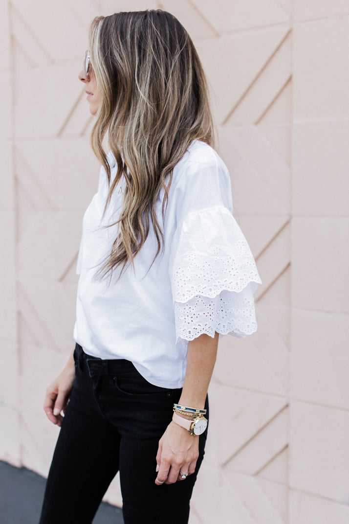an eyelet lace ruffle sleeve top makes a feminine fashion statement