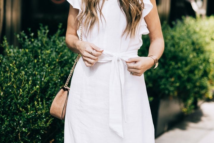 bow details on this white linen midi dress