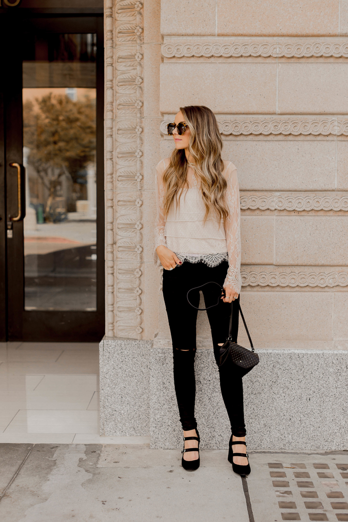 black jeans and a lace top make a perfect casual holiday look