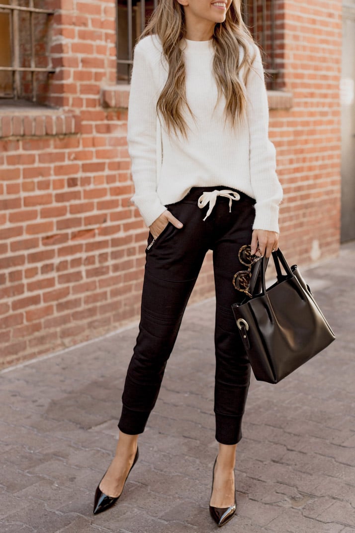 black joggers with black stiletto pumps