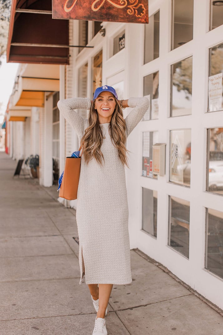 a midi dress and a pair of simple sneakers makes a great weekend outfit