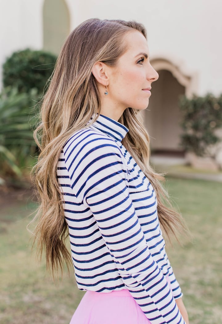 drop earrings and a turtleneck
