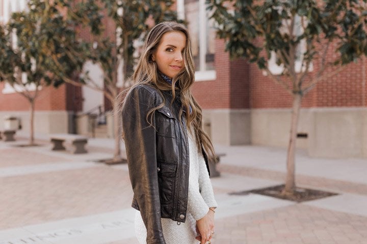black leather jacket and gray midi dress