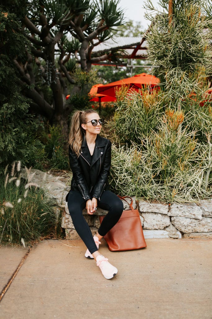 black leggings and pink sneakers