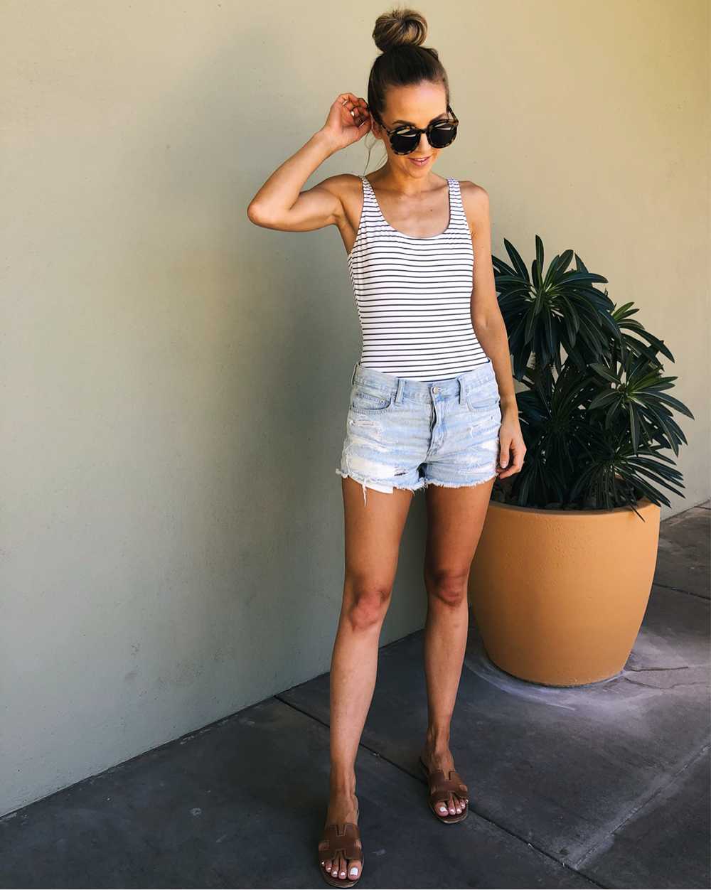 striped one piece swimsuit with denim shorts