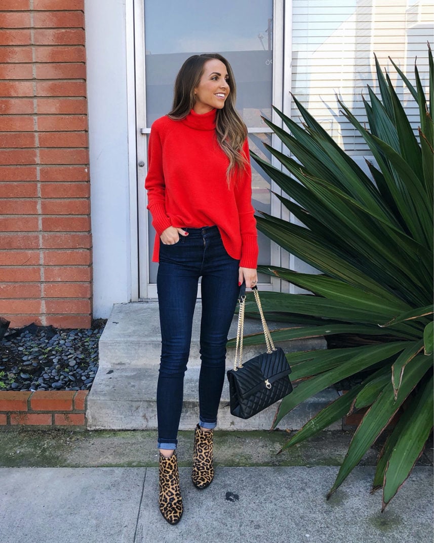 red sweater with dark wash jeans and leopard boots