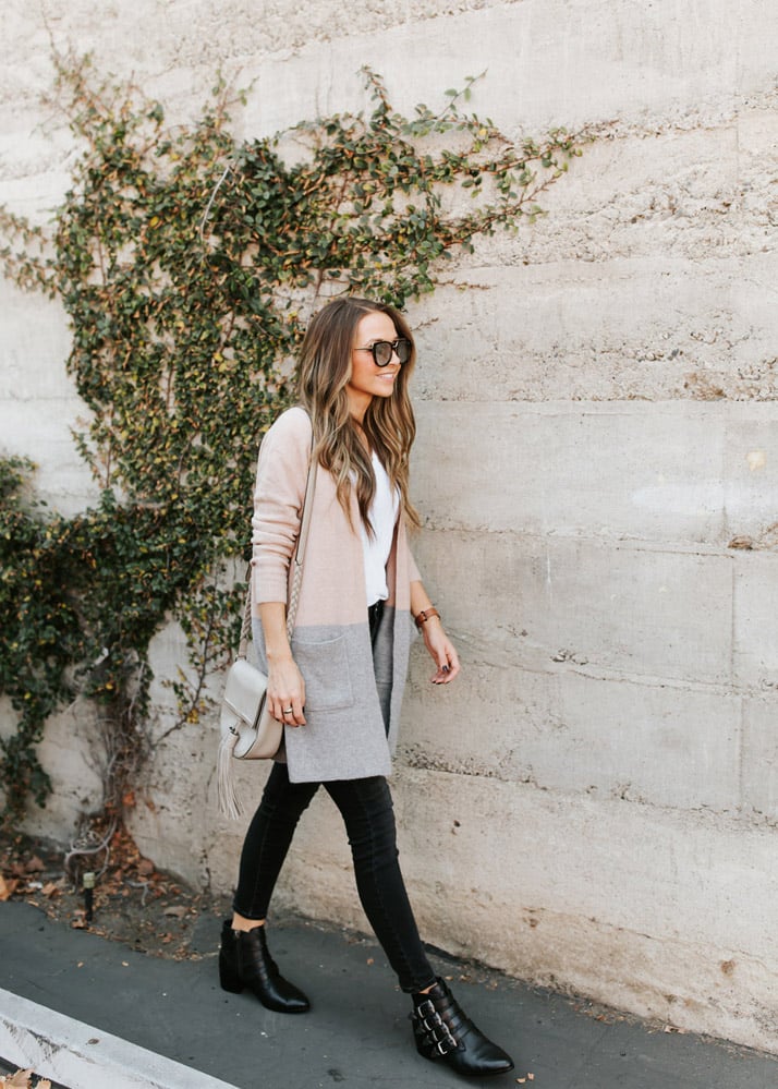 madewell pink and gray cardigan black jeans black buckle ankle boots