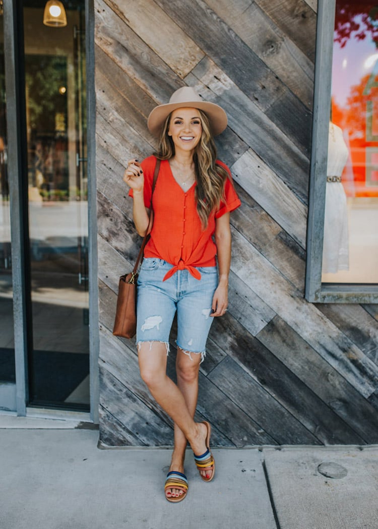 red top and bermuda shorts