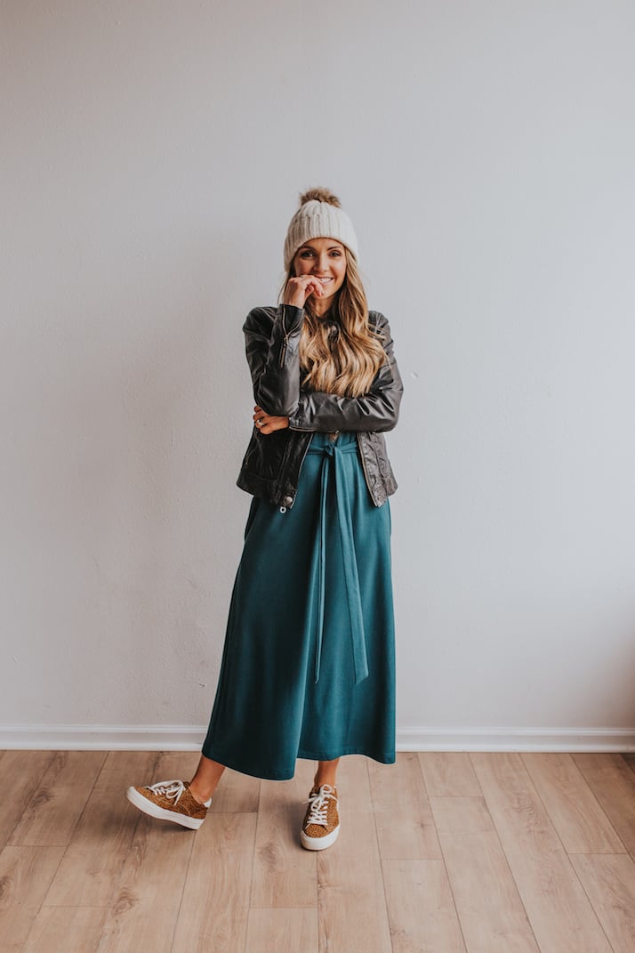 green midi dress with leopard sneakers and black leather jacket