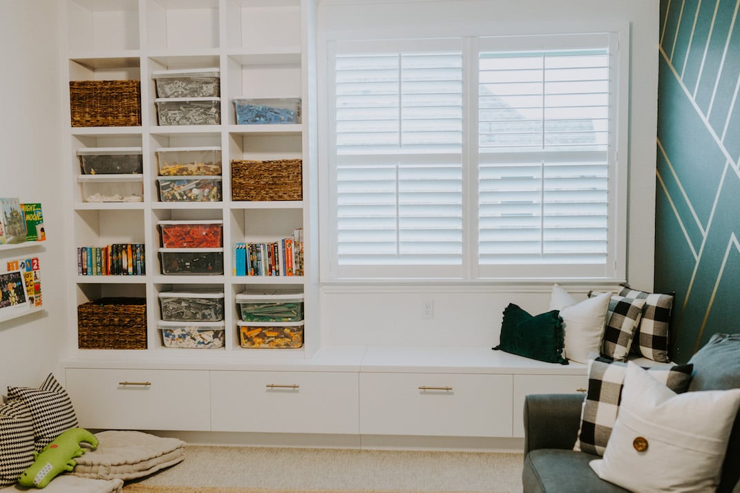 colorful bookshelf window seat and mural wall