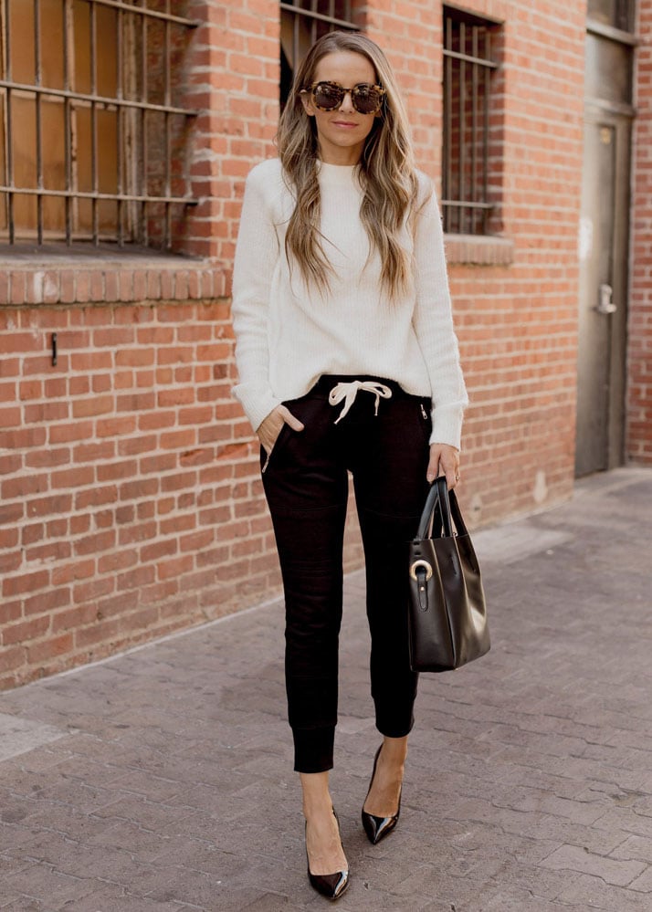 black joggers heels and a sweater