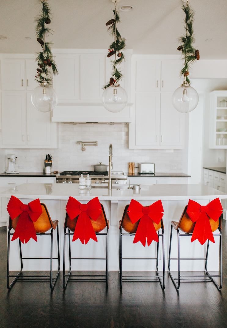 bow decorations for chairs, garlands on pendant lights