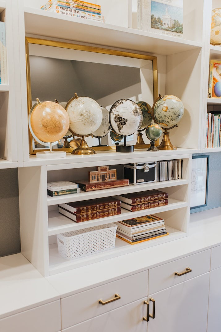 built in shelves with globe collection