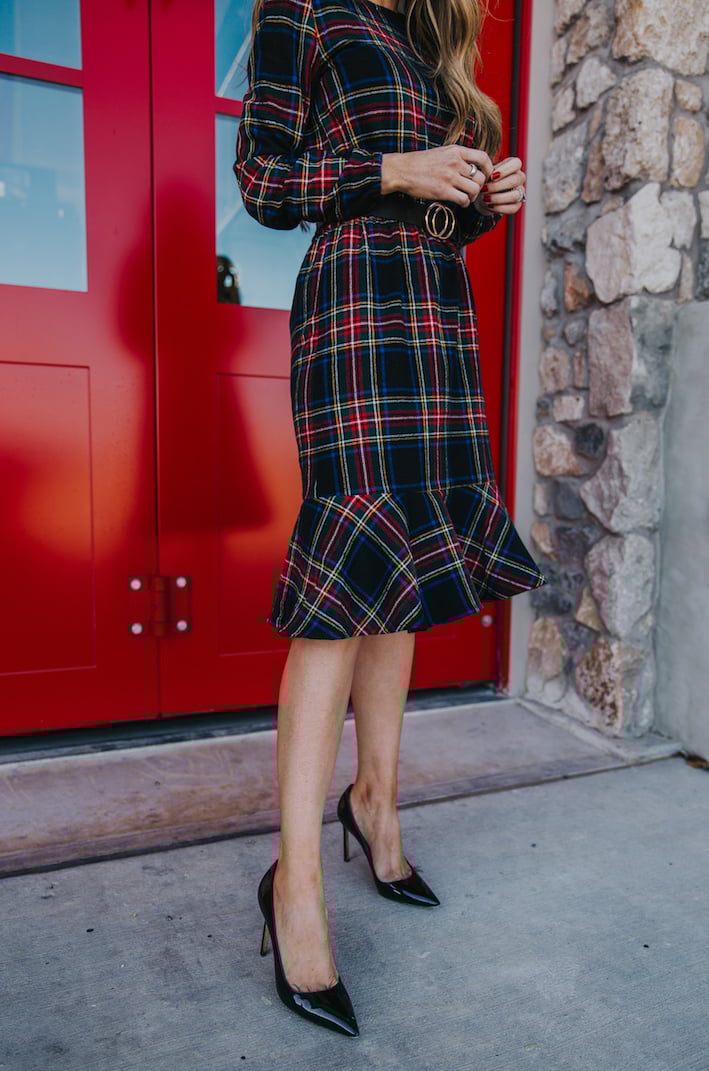 plaid dress with ruffle hem and black pointed pumps
