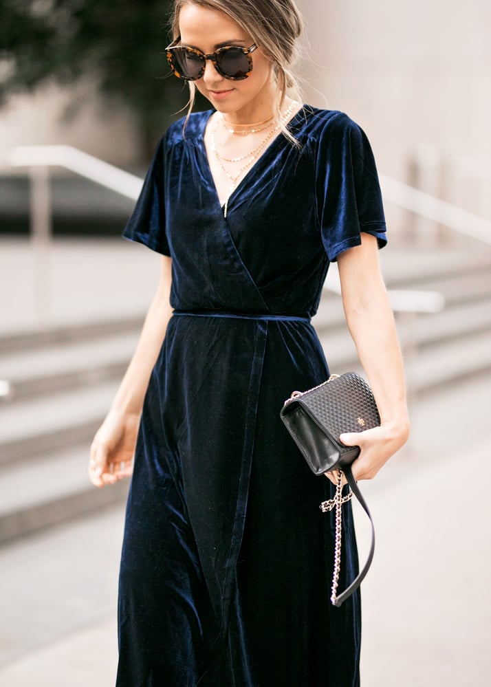 -black clutch and velvet dress