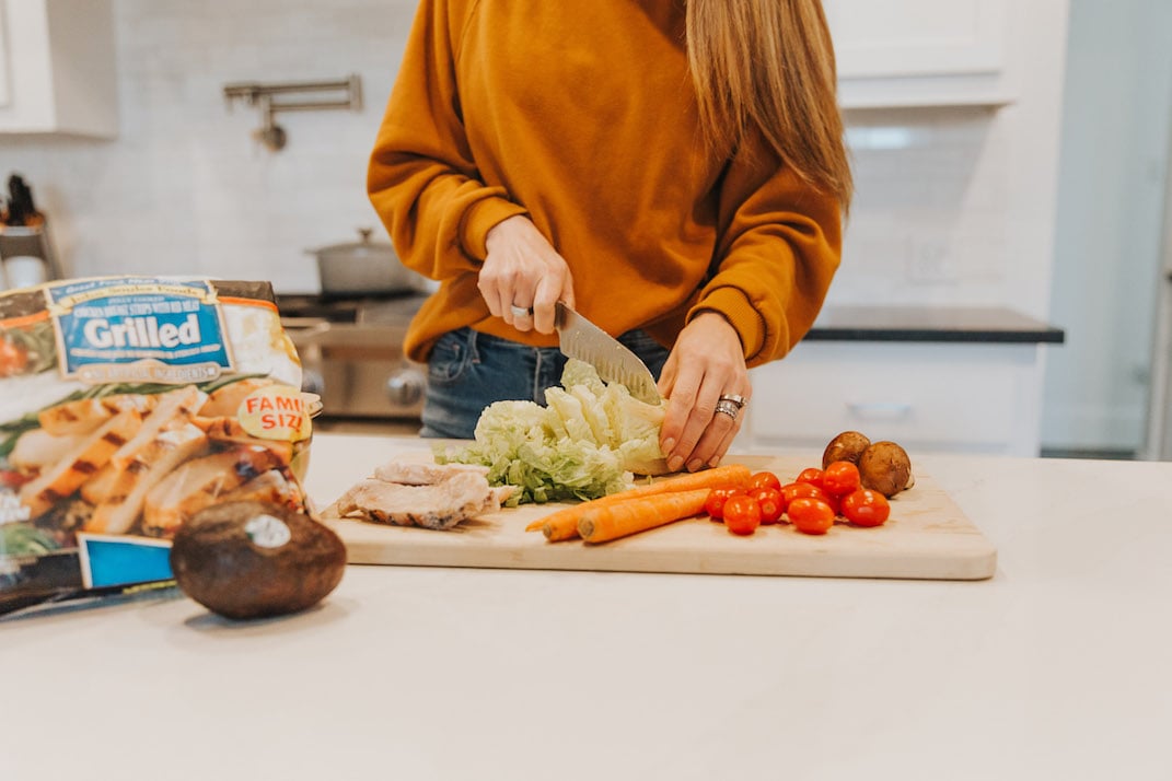 cutting board with fresh veggies for lunch salad