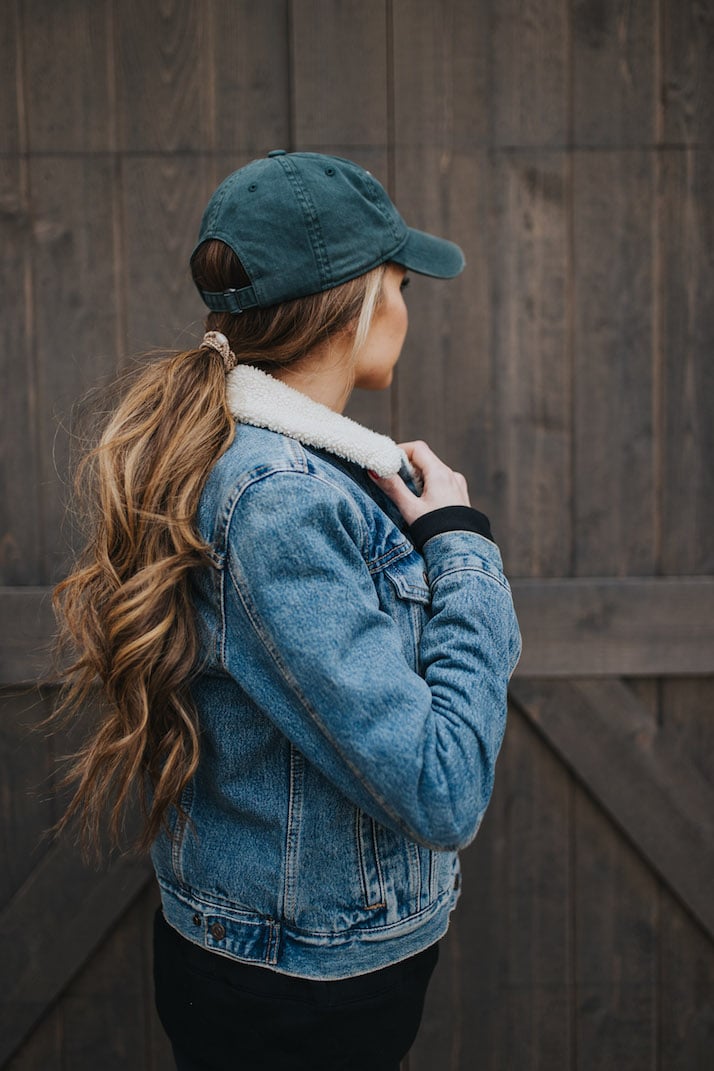 curled ponytail with shearling jacket