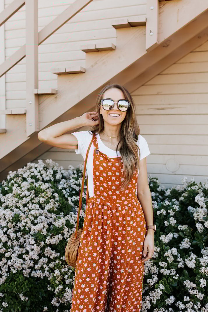 orange jumpsuit and quay sunglasses