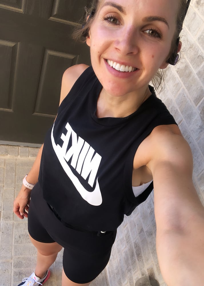 black tank and running shorts