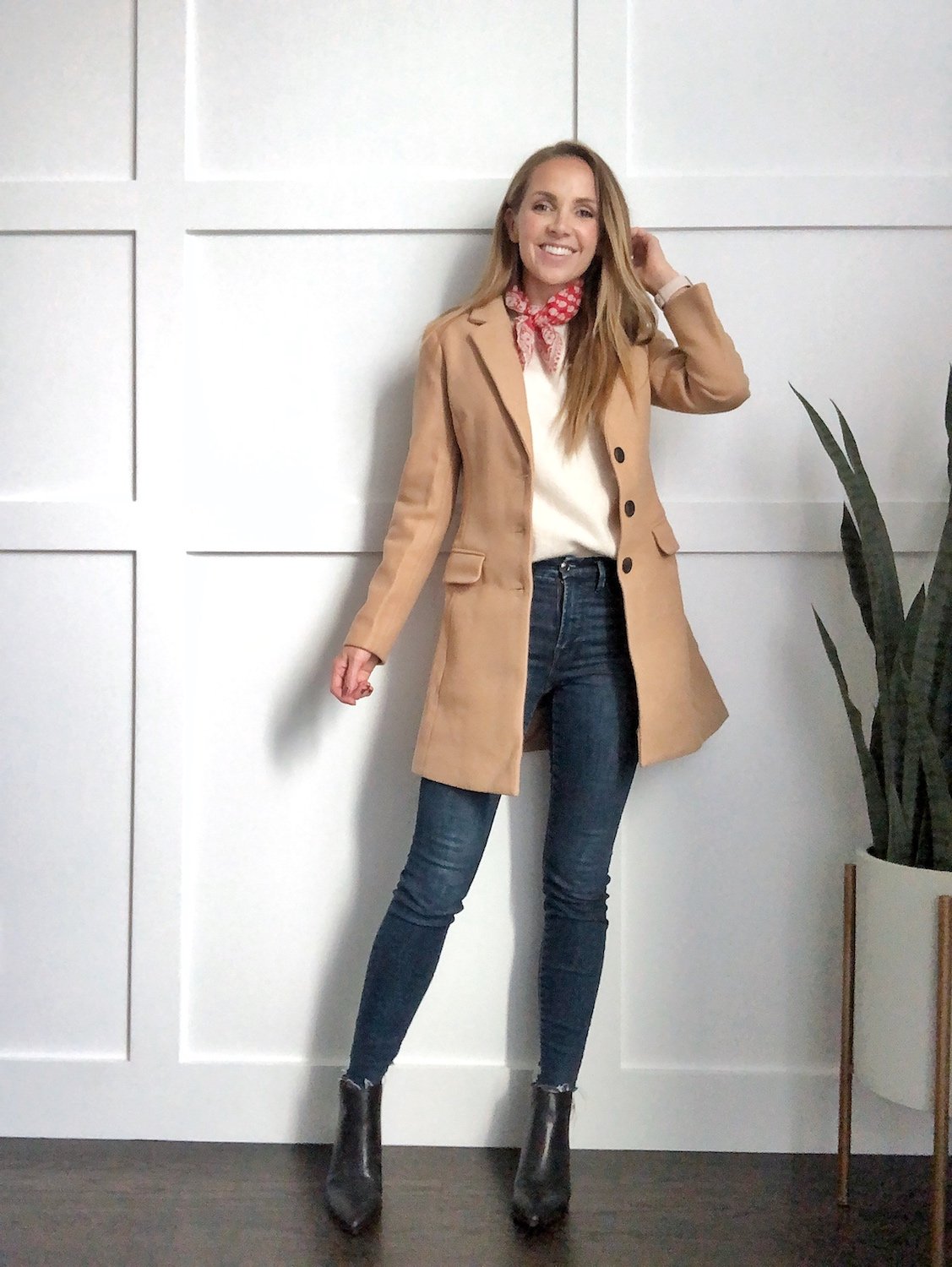 black bootie outfits: camel jacket with dark jeans and neck scarf