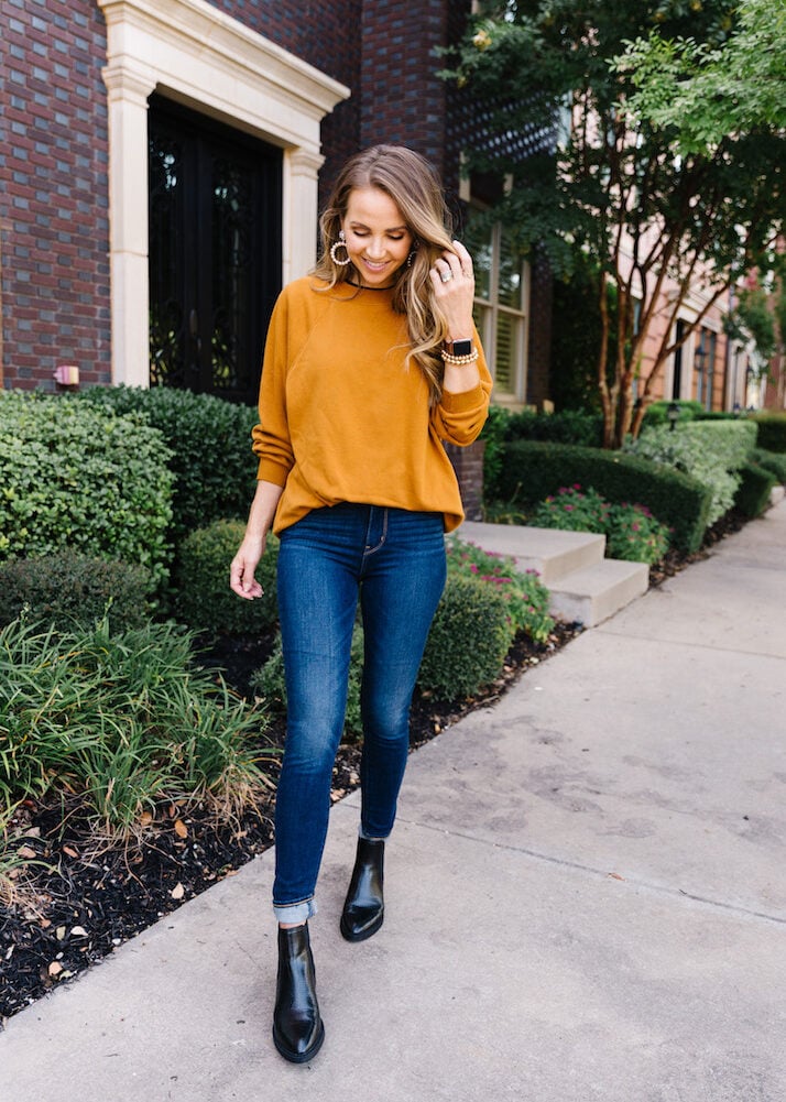 camel sweatshirt with pearl earrings