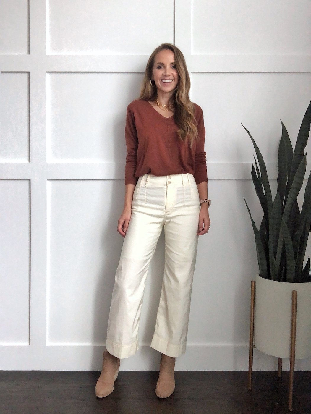 Winter whites outfit: wide leg pants with rust sweater