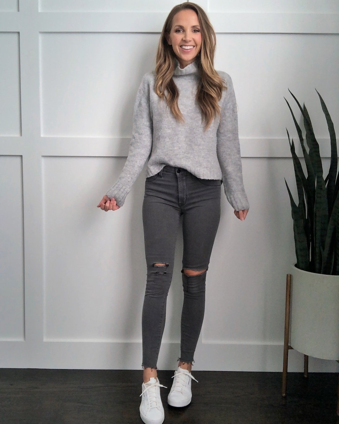 white sneakers in the fall: gray sweater and gray jeans