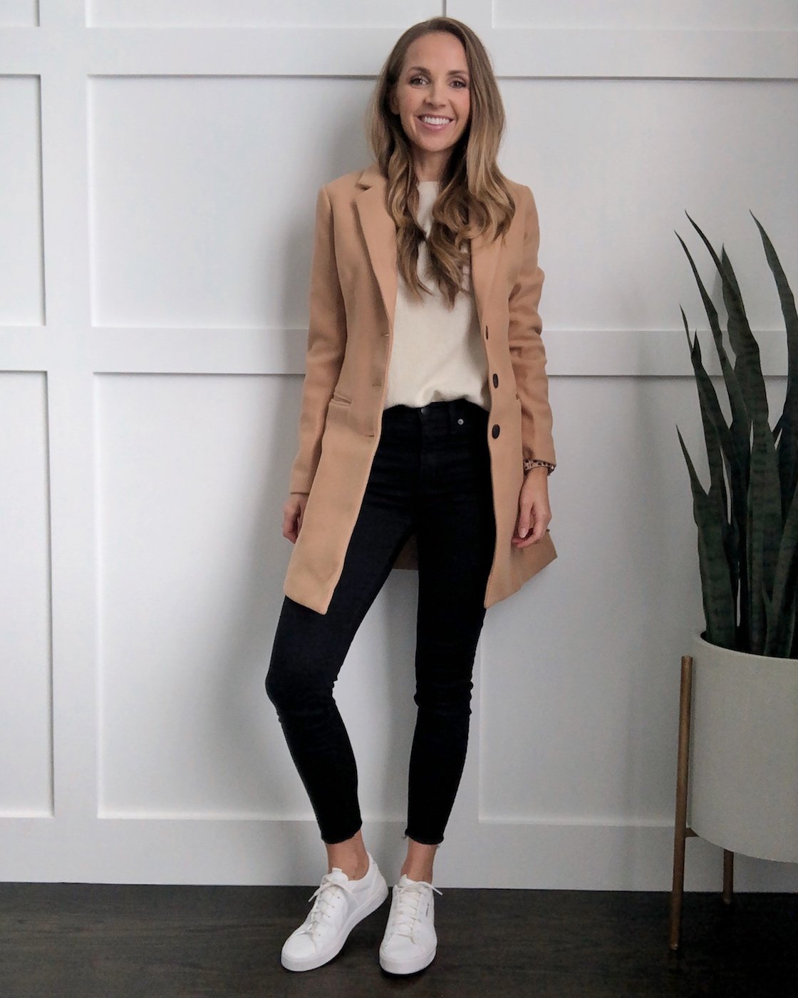white sneakers in the fall: tan coat and black jeans