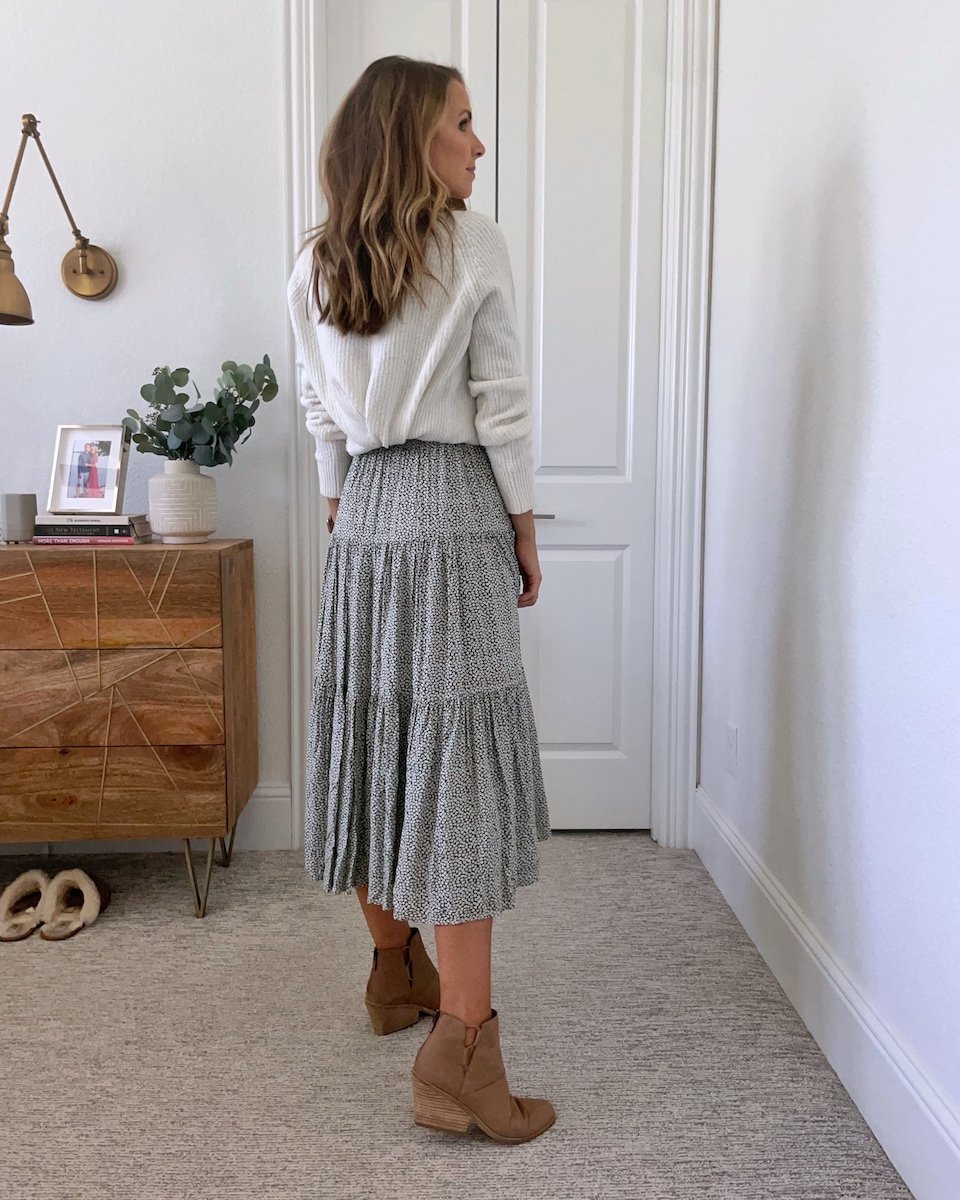sweater tucked behind dress