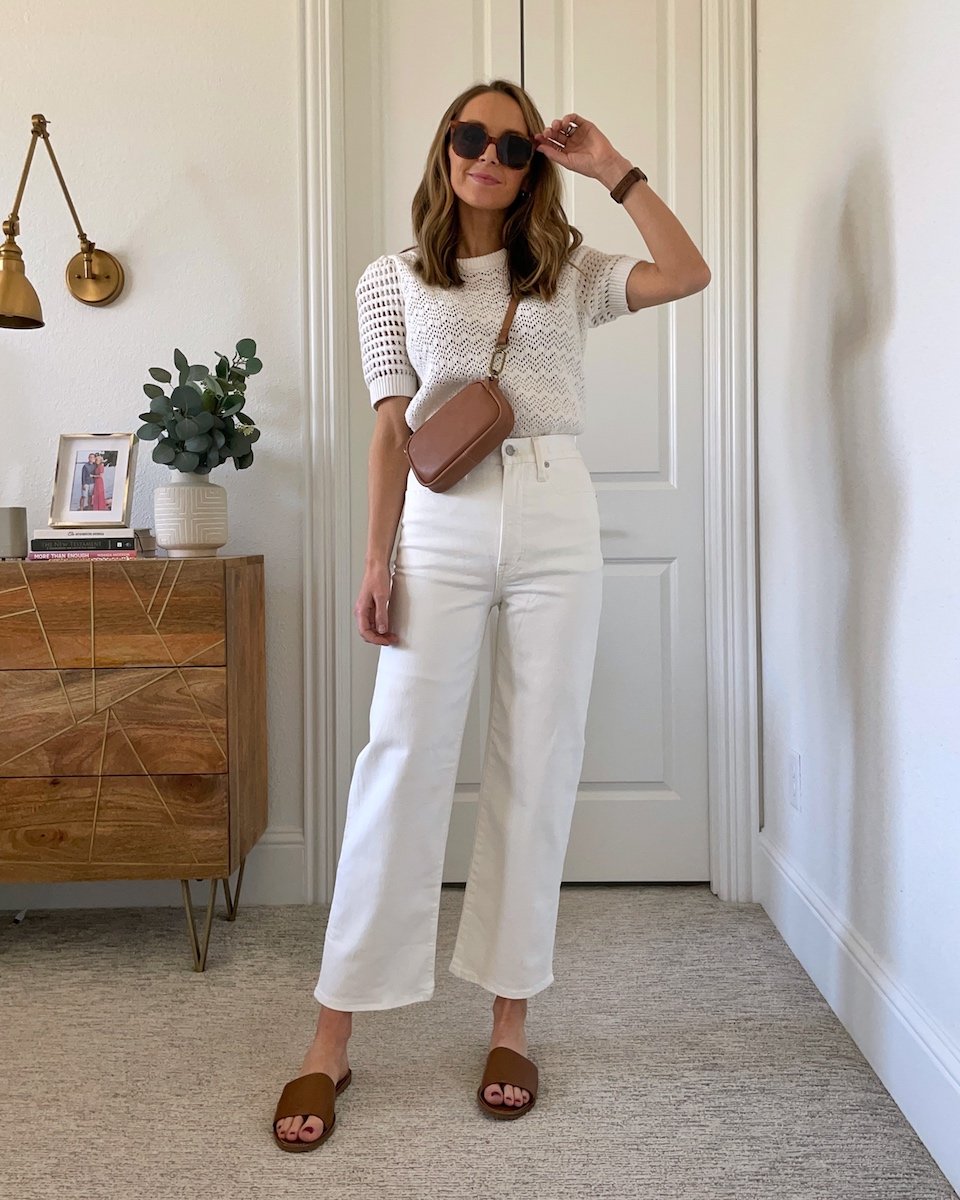 white jeans with white sweater and cross body bag