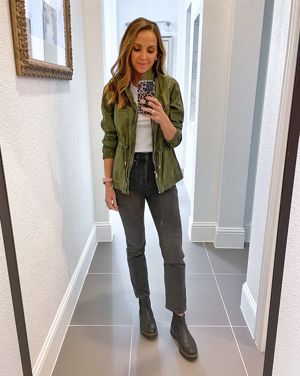 black chelsea boots with gray jeans and olive jacket