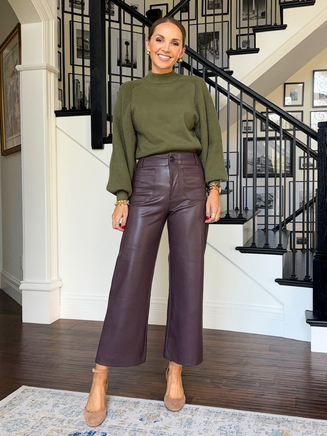 brown leather pants and olive green sweater